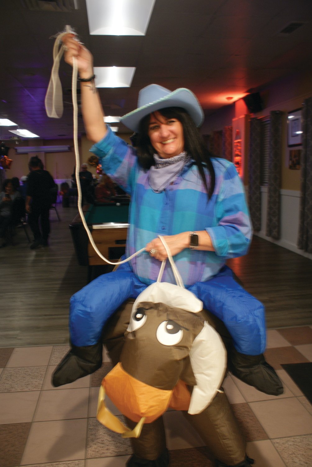 RODEO!  Riding the costume bull was Dawn Vittorioso during the St. Mary’s Feast Society Halloween Party this past weekend.